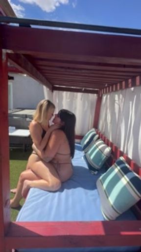Lesbians making out before fucking outside in pool cabana