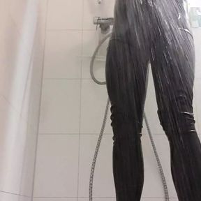 In the shower with a latex suit