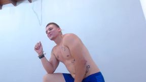 Muscled Latino Man Speaks with an Admirer
