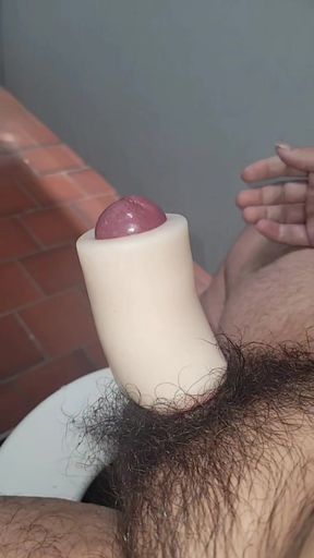 Maori guy jerks himself off with sex toy in public toilet.