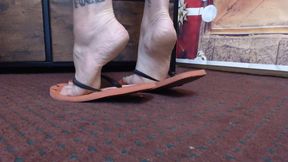 Flipflop shoeplay standing closeup Milf