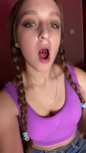 Giantess looks to tiny man before eating