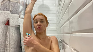 Sexy redhead shaving her hairy armpits 4K 60 FPS