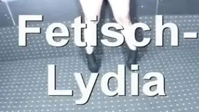 French domina plays with her latex-clad pussy on camera