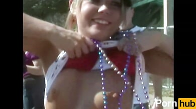 College girls flirt and flash at a wild outdoor party with beads and piercings