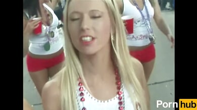 College girls flirt and flash at a wild outdoor party with beads and piercings