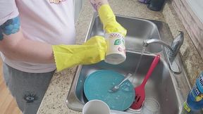 Washing Dishes with Yellow Gloves and Drying Them with Dish Towel