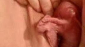 My bitch rubs her huge clit and her big pussy lips until cumming