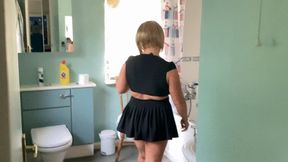 Sexy pee in the bath in a sexy black uniform