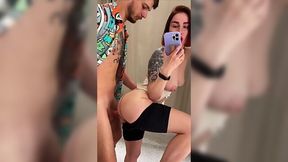 Passionate sex with a redhead in the changing room