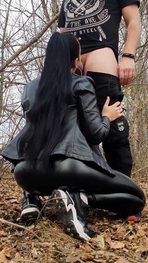 Ponytail Girl in a Leather Outfit Sucks Cock in the Forest and Takes Cum on Her Face - Vertical Vid