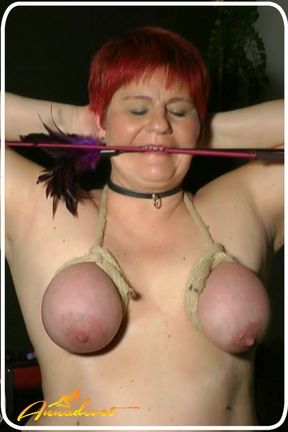 Large, bound BBW tits are spanked, which makes her pussy wet.