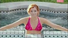 Alyson Hannigan poses in bright pink bikini in the pool