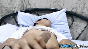 ”Asian twink plays with his shaft & feet in his bedroom”