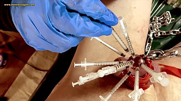 Dominatrix Mistress April - syringes in cock head