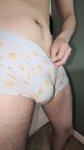 Handsome twink shows off his bulging package in tight shorts