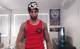 Tattooed stud kerks off and cums hard on cam