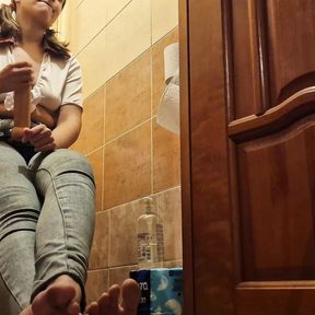 Mistress punishes slave with strapon in toilet