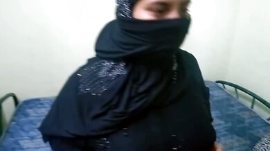 Chubby woman in hijab rides her partner on a blue mattress