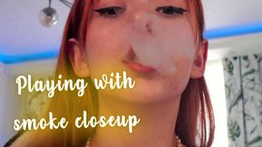 Playing with smoke closeup