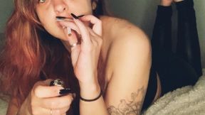 Leather pants, barefoot, and smoking