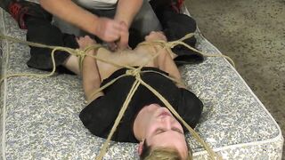 Young blond twinky roped down for a powerful handjob