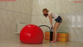 Alla inflates a huge fitness ball with a hand pump and jumps on it!!!