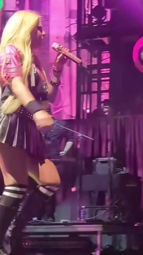 Blonde babe Avril Lavigne shows off tight ass and thick big tits
