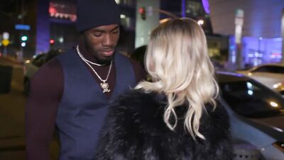 Elegant young blonde in a sexy red dress fucked by a black guy