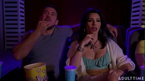 buttering her popcorn