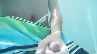 Twink jerks off and cums in public pool