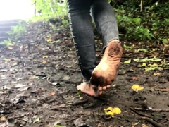 Wild foot fetishist enjoys walking barefoot in the mud