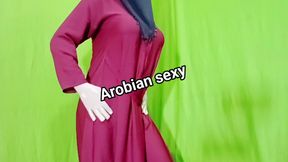Arabian woman enjoying taking off all her clothes