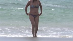 Hairy mature shows off on the beach while masturbating