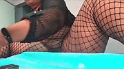 Horny ebony girl uses her feet to play with a dildo and then masturbates