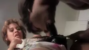 Black Darling sucking strapon dick