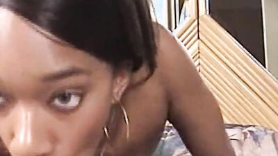 A sexy ebony babe with big tits sucks small white dick