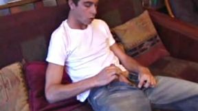 Vincenzo shows off his new purchase, strokes his cock, and uses a sex toy on the couch