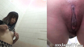 Naughty Japanese beautiful babe fingers her muff in public toilet