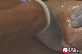 Lubed up homo has his ass gaped and fisted in threesome