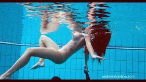 Playful Nata swims in a pool in nice dress and fleshing her nice booty