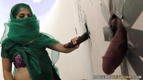 ”Stunning Pakistani babe visits the gloryhole for black shaft”