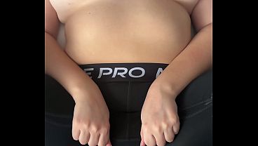 A curvy amateur with a big butt and natural tits wears tight Nike Pro leggings