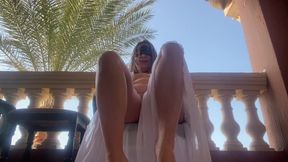 Hairy Pussy on the Outdoor Balcony Masturbates and Orgasms with Squirting.