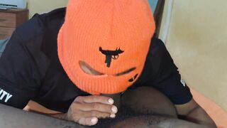 Watch this security guard deepthroat a huge black cock and get a mouthful of cum