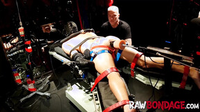 Chained jock Devin Franco lying face down being fisted in his butt