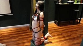 The barefoot girl in her restrictive underwear vibrated until she reached orgasm.