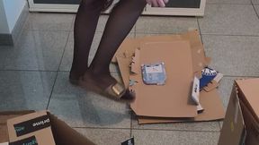 Carina Crushing cardboard boxes with Birkenstock Madrid in Nylons