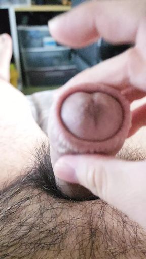 Stroking and playing with foreskin