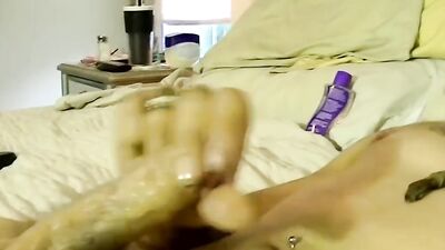 Bearded guy jerks off before fucking jock in the mouth